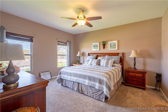 bedroom featuring carpet flooring, baseboards, and ceiling fan
