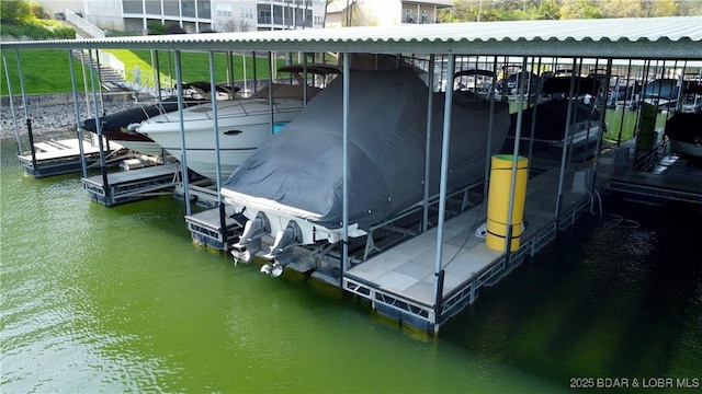 dock with a water view and boat lift