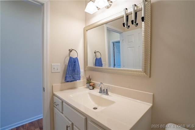 bathroom featuring vanity and wood finished floors