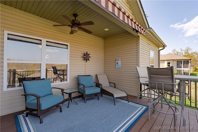 wooden deck featuring a ceiling fan