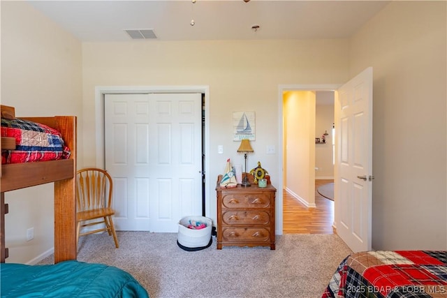 bedroom with carpet floors and a closet
