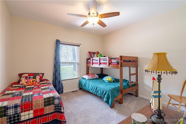 carpeted bedroom with baseboards and ceiling fan