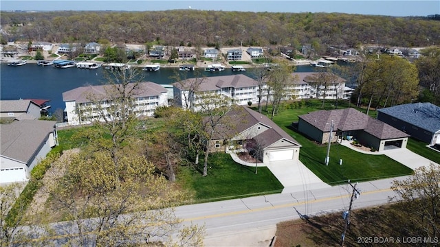 aerial view of residential area with a large body of water