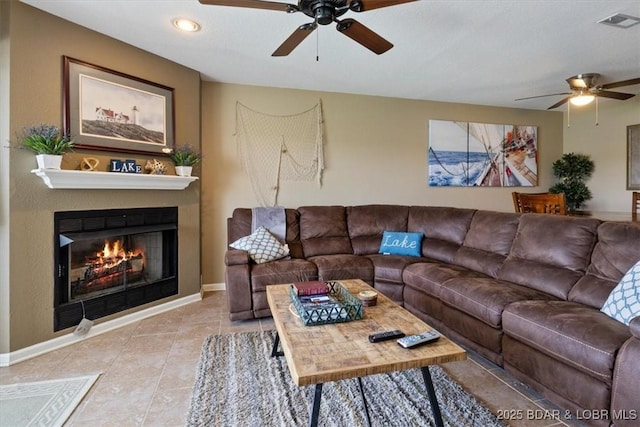4800 Eagleview Dr Unit 133, Osage Beach, MO 65065 - tiled living area featuring ceiling fan, baseboards, a warm lit fireplace, and recessed lighting