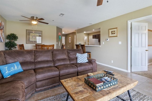 4800 Eagleview Dr Unit 133, Osage Beach, MO 65065 - living area featuring ceiling fan, tile patterned floors, and baseboards