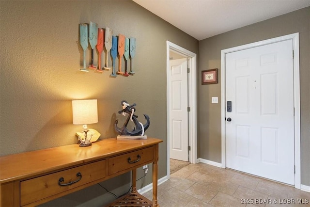 4800 Eagleview Dr Unit 133, Osage Beach, MO 65065 - foyer entrance with baseboards and light tile patterned flooring