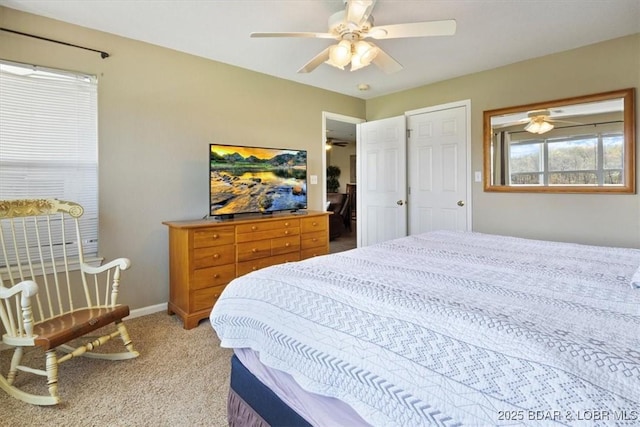 4800 Eagleview Dr Unit 133, Osage Beach, MO 65065 - bedroom with light colored carpet, ceiling fan, and baseboards