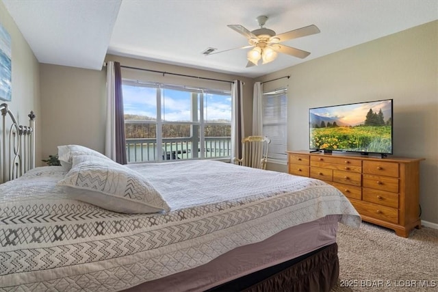 4800 Eagleview Dr Unit 133, Osage Beach, MO 65065 - carpeted bedroom featuring a ceiling fan and baseboards