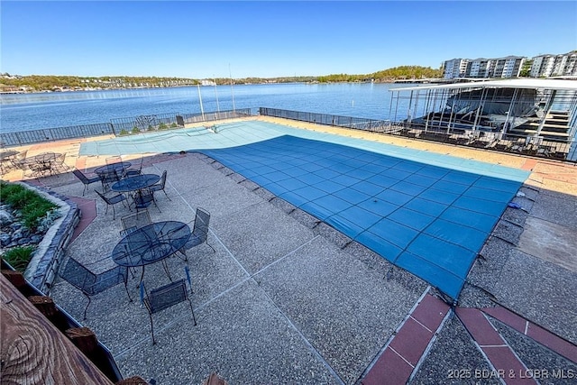 138 Falls Dr Unit 2B, Lake Ozark, MO 65049 - pool featuring fence, a patio area, and a water view
