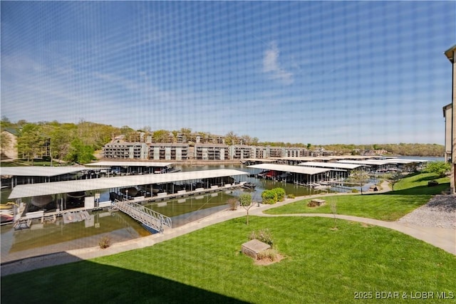 245 Bristol Bay Dr Unit 2B, Lake Ozark, MO 65049 - dock area with a lawn, boat lift, and a water view