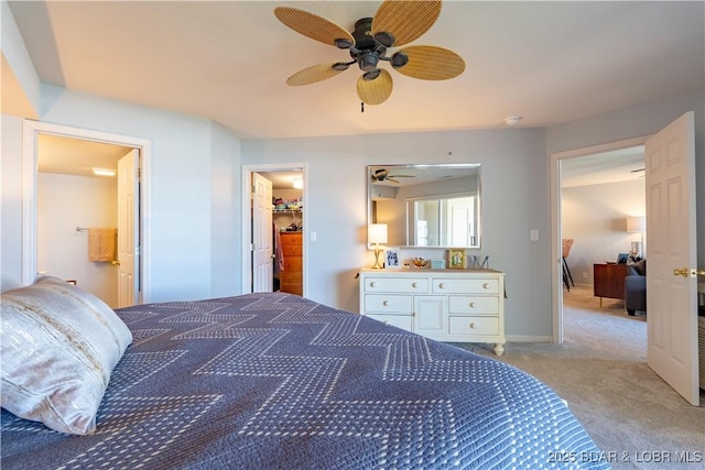 245 Bristol Bay Dr Unit 2B, Lake Ozark, MO 65049 - bedroom featuring light carpet, a spacious closet, ensuite bathroom, and a ceiling fan