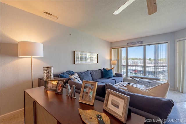 245 Bristol Bay Dr Unit 2B, Lake Ozark, MO 65049 - living area with carpet flooring, baseboards, and ceiling fan