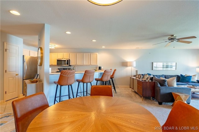 245 Bristol Bay Dr Unit 2B, Lake Ozark, MO 65049 - dining room with recessed lighting, ceiling fan, and baseboards