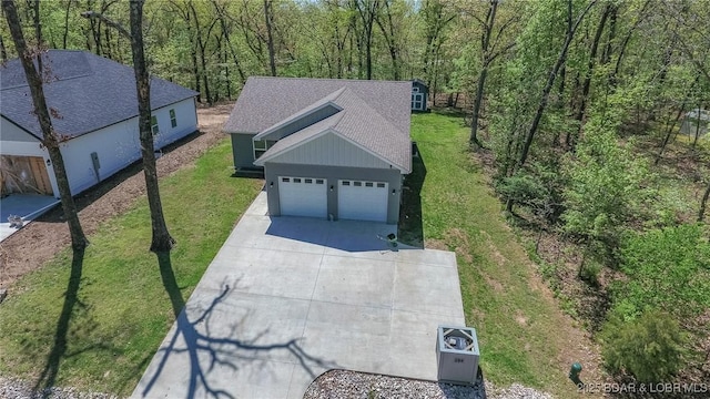 284 Bloomington Dr, Lake Ozark, MO 65049 - view of subject property with a forest