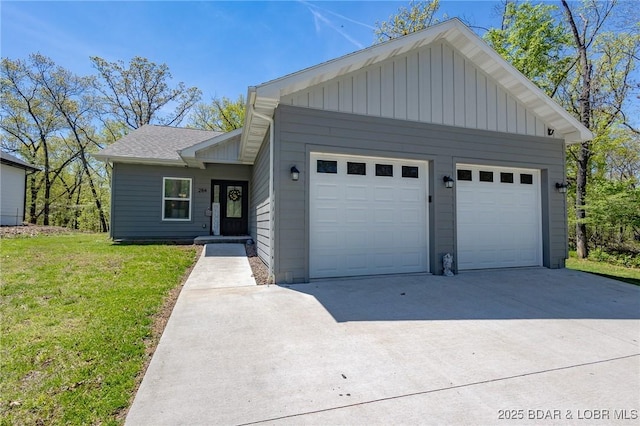 284 Bloomington Dr, Lake Ozark, MO 65049 - view of front facade featuring board and batten siding, a garage, a front yard, and a shingled roof