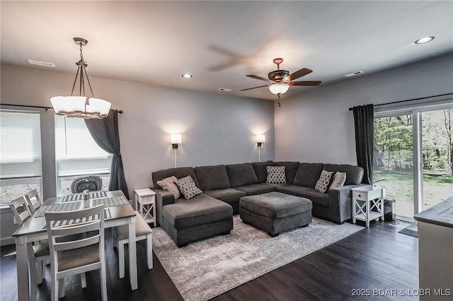 284 Bloomington Dr, Lake Ozark, MO 65049 - living room featuring dark wood-style flooring, a chandelier, a ceiling fan, and recessed lighting