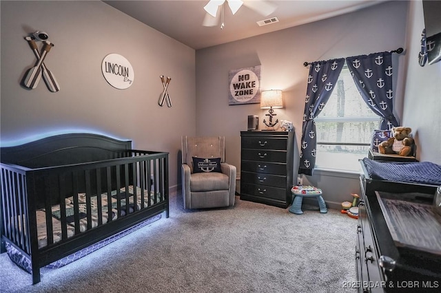 284 Bloomington Dr, Lake Ozark, MO 65049 - bedroom featuring a crib, carpet, and ceiling fan