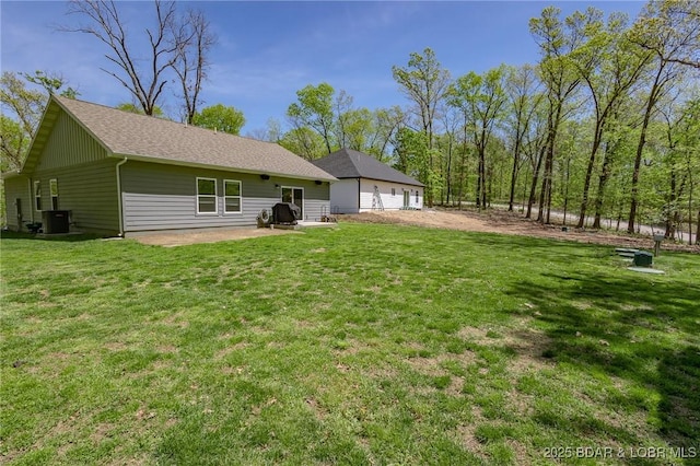 284 Bloomington Dr, Lake Ozark, MO 65049 - back of house featuring a yard and a patio