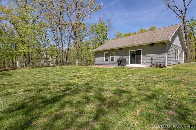 284 Bloomington Dr, Lake Ozark, MO 65049 - rear view of house featuring a patio area and a yard