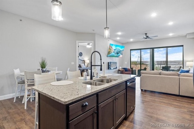 1065 Topsider Ln Unit 508, Osage Beach, MO 65065 - kitchen with dark brown cabinetry, stainless steel dishwasher, a ceiling fan, and a sink