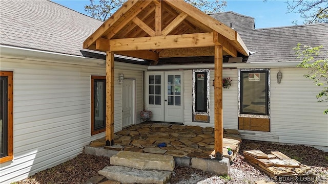 342 Porter Mill Springs Dr, Sunrise Beach, MO 65079 - view of exterior entry with a shingled roof