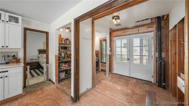 342 Porter Mill Springs Dr, Sunrise Beach, MO 65079 - interior space with visible vents and french doors