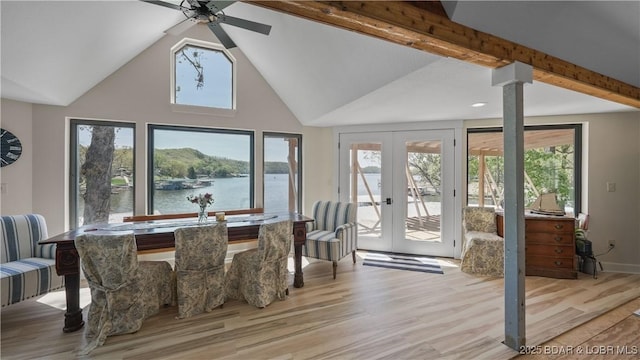 342 Porter Mill Springs Dr, Sunrise Beach, MO 65079 - dining area with a ceiling fan, a water view, french doors, light wood-style flooring, and ornate columns