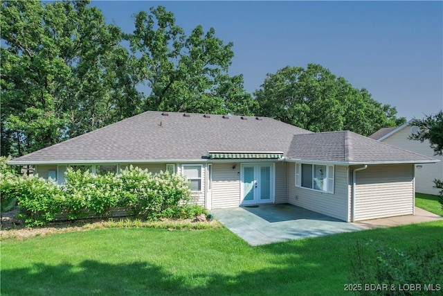 3796 Meadow Ln, Osage Beach, MO 65065 - back of property featuring a lawn, a shingled roof, french doors, and a patio area