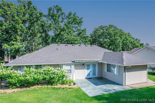 3796 Meadow Ln, Osage Beach, MO 65065 - rear view of property with roof with shingles, a lawn, and a patio