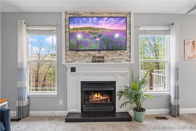 63 Lancelot Ct, Camdenton, MO 65020 - detailed view of carpet flooring, baseboards, and a tile fireplace