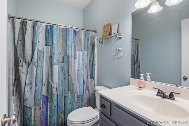 bathroom with a shower with shower curtain, toilet, and vanity