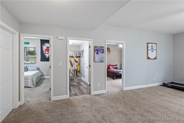 63 Lancelot Ct, Camdenton, MO 65020 - carpeted bedroom with a walk in closet, baseboards, and a closet