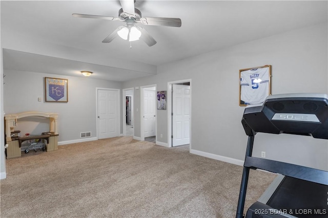63 Lancelot Ct, Camdenton, MO 65020 - workout area featuring carpet floors, a ceiling fan, and baseboards
