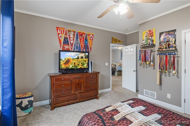 carpeted bedroom with visible vents, ceiling fan, crown molding, and baseboards