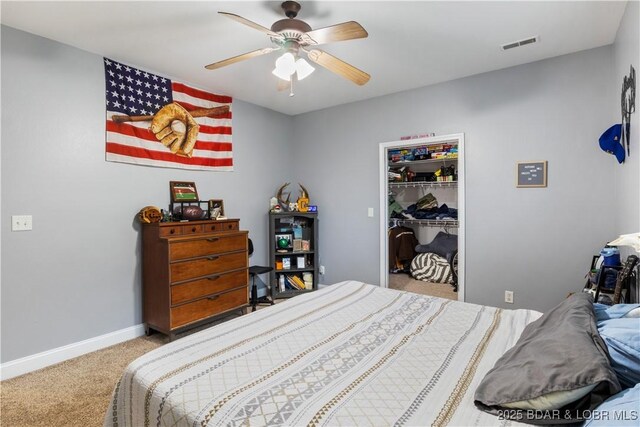 bedroom featuring carpet flooring, visible vents, a closet, baseboards, and a ceiling fan