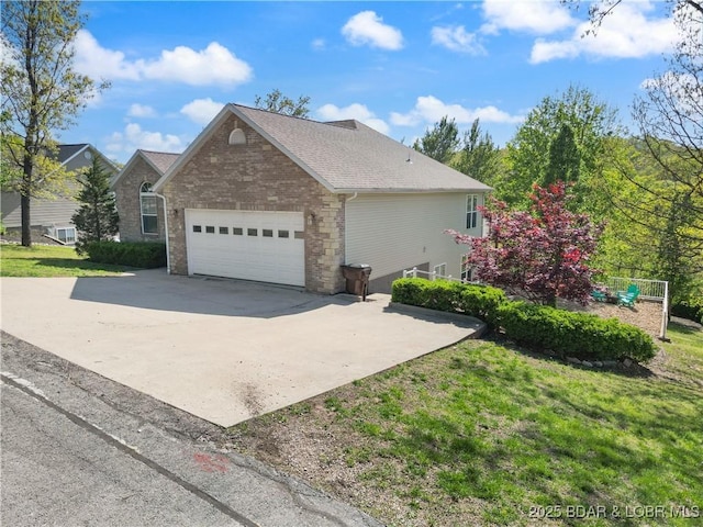63 Lancelot Ct, Camdenton, MO 65020 - view of home's exterior with driveway, an attached garage, roof with shingles, and a lawn