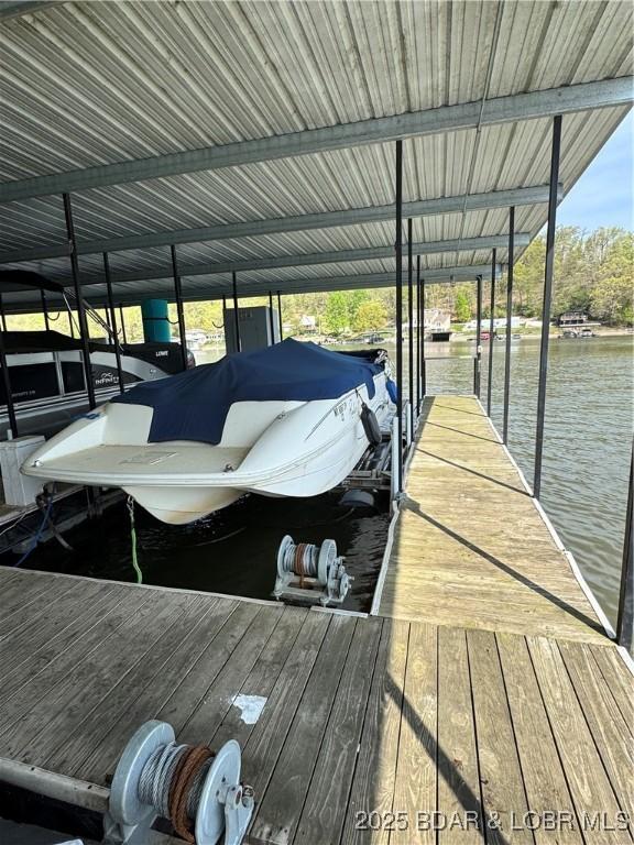 dock area featuring a water view and boat lift