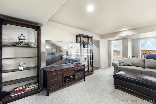 living room featuring baseboards, recessed lighting, and carpet floors
