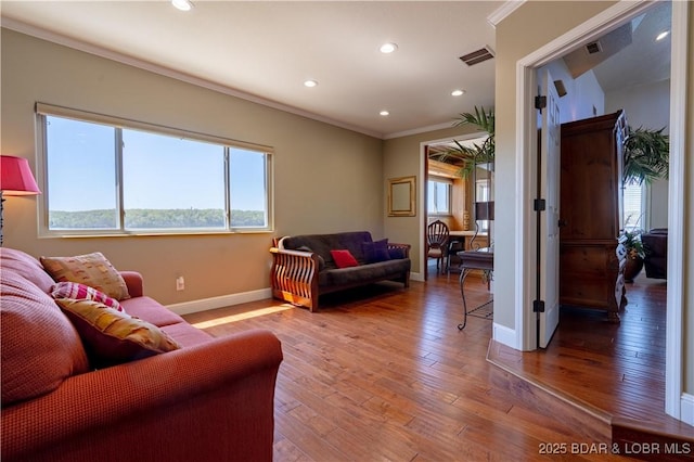 4956 Shorewood Dr, Osage Beach, MO 65065 - living area with recessed lighting, wood-type flooring, visible vents, baseboards, and ornamental molding