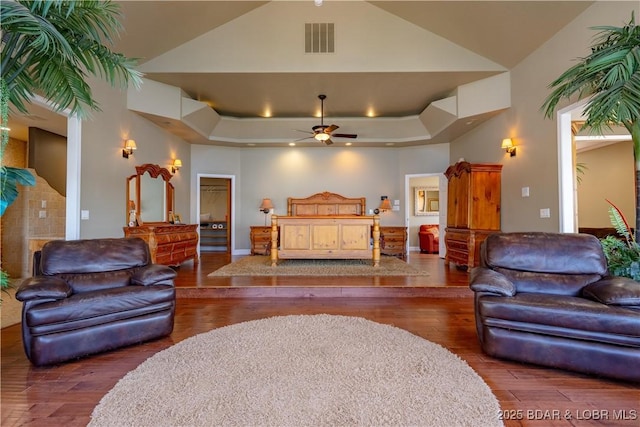 4956 Shorewood Dr, Osage Beach, MO 65065 - living area featuring visible vents, ceiling fan, high vaulted ceiling, and hardwood / wood-style flooring