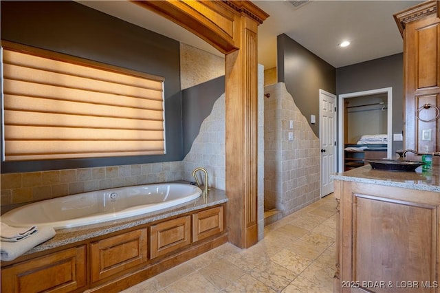 4956 Shorewood Dr, Osage Beach, MO 65065 - bathroom featuring recessed lighting, a bath, and vanity