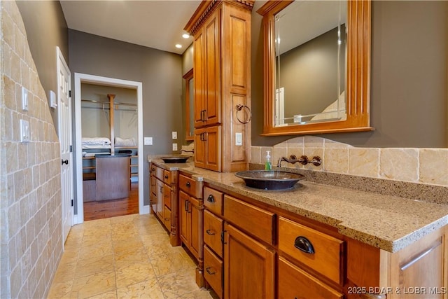 4956 Shorewood Dr, Osage Beach, MO 65065 - bathroom featuring backsplash, double vanity, and a sink