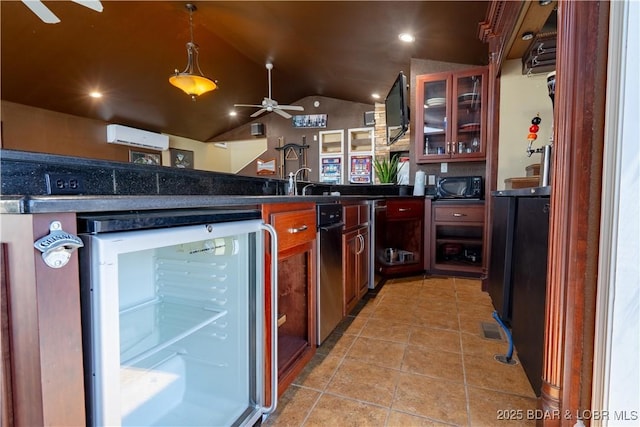 4956 Shorewood Dr, Osage Beach, MO 65065 - kitchen featuring a ceiling fan, black microwave, a peninsula, vaulted ceiling, and dark countertops