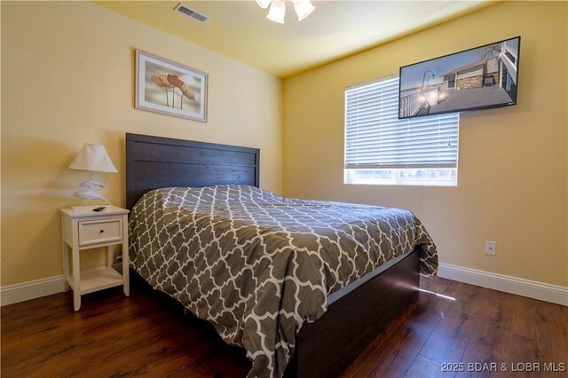 4956 Shorewood Dr, Osage Beach, MO 65065 - bedroom featuring baseboards, visible vents, and wood-type flooring