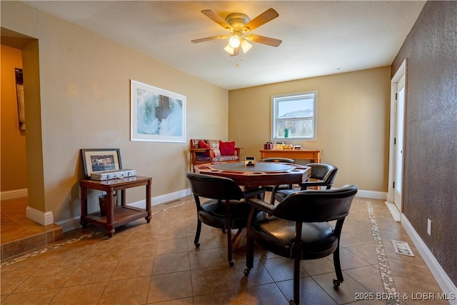 4956 Shorewood Dr, Osage Beach, MO 65065 - tiled dining space featuring baseboards, visible vents, and a ceiling fan