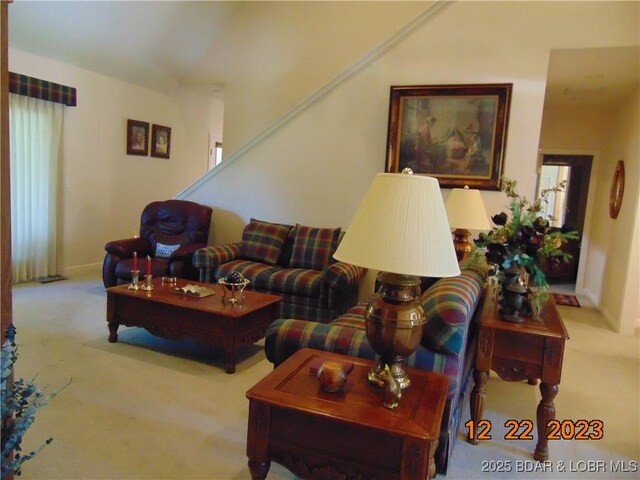 1932 Mimosa Ct, Lebanon, MO 65536 - carpeted living area with baseboards and vaulted ceiling
