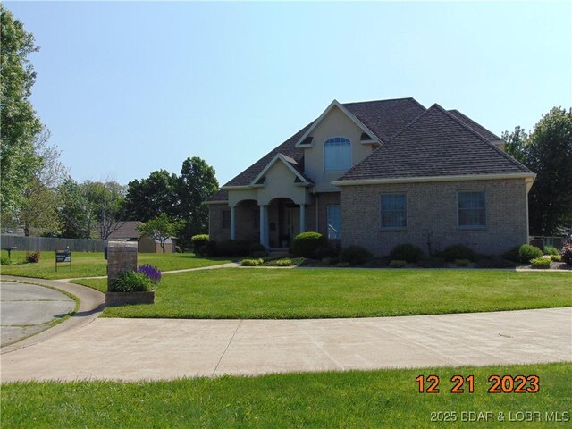 1932 Mimosa Ct, Lebanon, MO 65536 - traditional-style house with roof with shingles