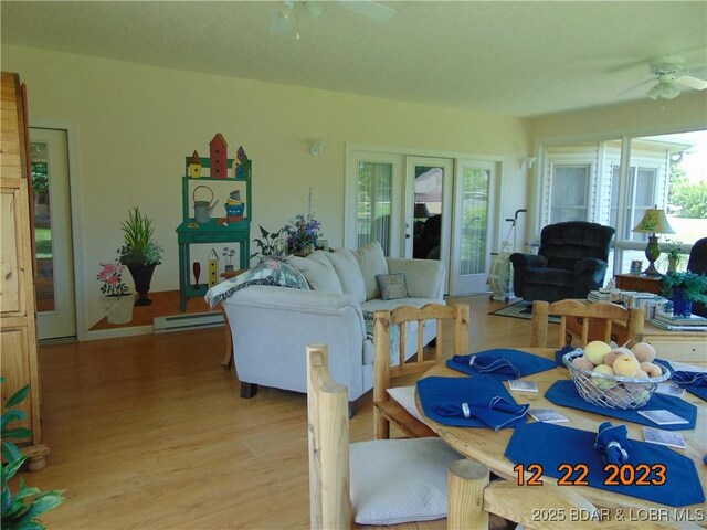 1932 Mimosa Ct, Lebanon, MO 65536 - dining space featuring a ceiling fan, light wood-style flooring, and healthy amount of natural light