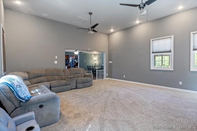 living room with baseboards, recessed lighting, ceiling fan, and carpet flooring