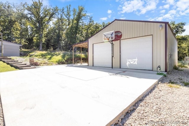 garage featuring a detached garage and concrete driveway